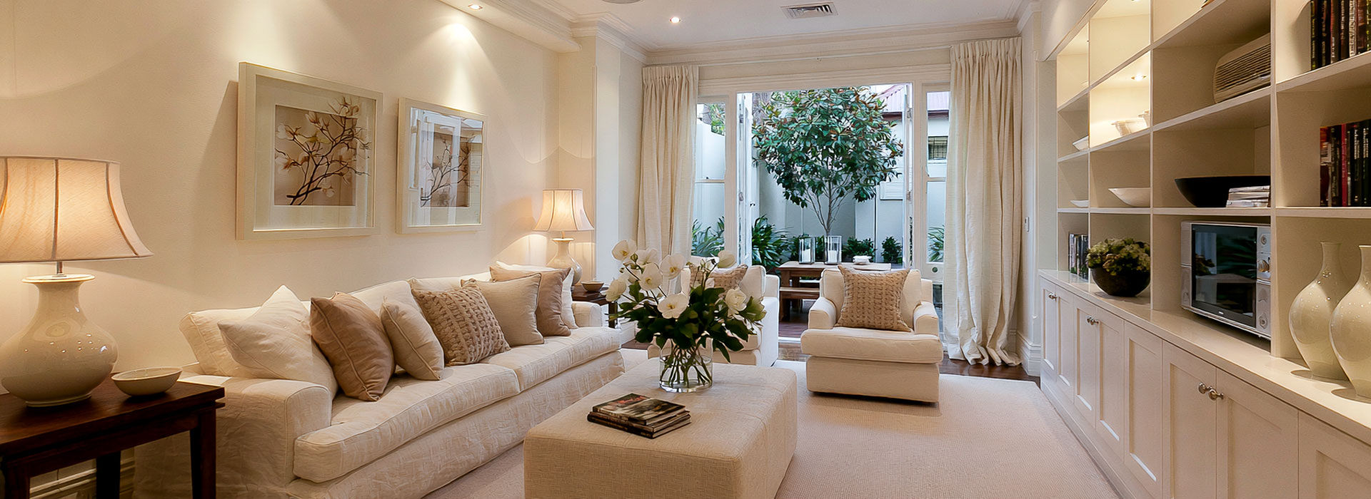 architectural photograph of a beautifully maintained contemporary Sydney terrace home interior, warm natural light, elegant functional lighting, clean finishes